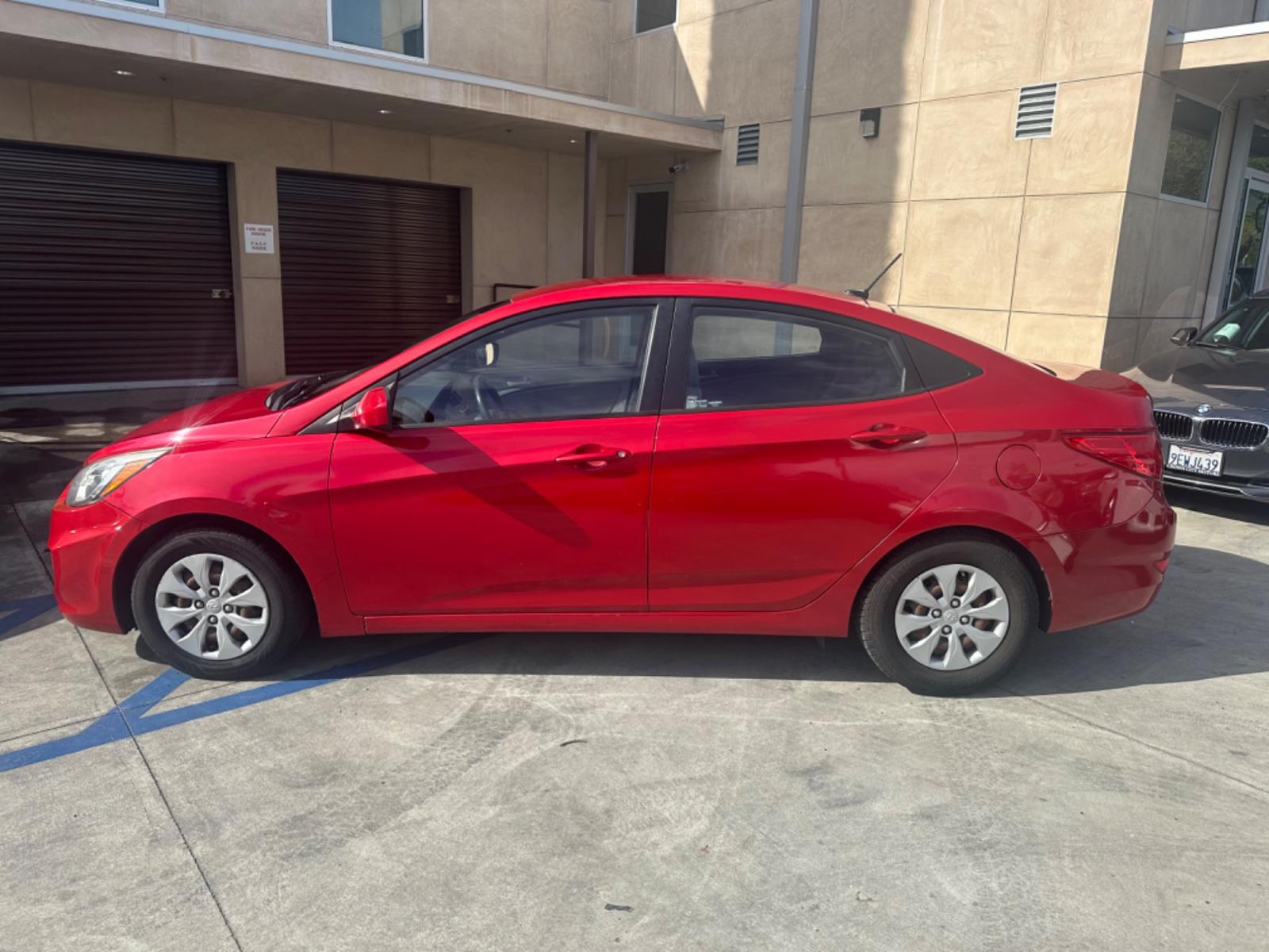 2015 Red /Gray Hyundai Accent GLS Sedan 4D (KMHCT4AE2FU) with an 4-Cyl, 1.6L engine, Auto, 6-Spd w/Overdrive transmission, located at 30 S. Berkeley Avenue, Pasadena, CA, 91107, (626) 248-7567, 34.145447, -118.109398 - The 2015 Hyundai Accent 4-Door Sedan stands as a testament to Hyundai's commitment to quality, efficiency, and value. Located in Pasadena, CA, our dealership specializes in providing a wide range of used BHPH (Buy Here Pay Here) cars, trucks, SUVs, and vans, including the remarkable Hyundai Accent. - Photo #2